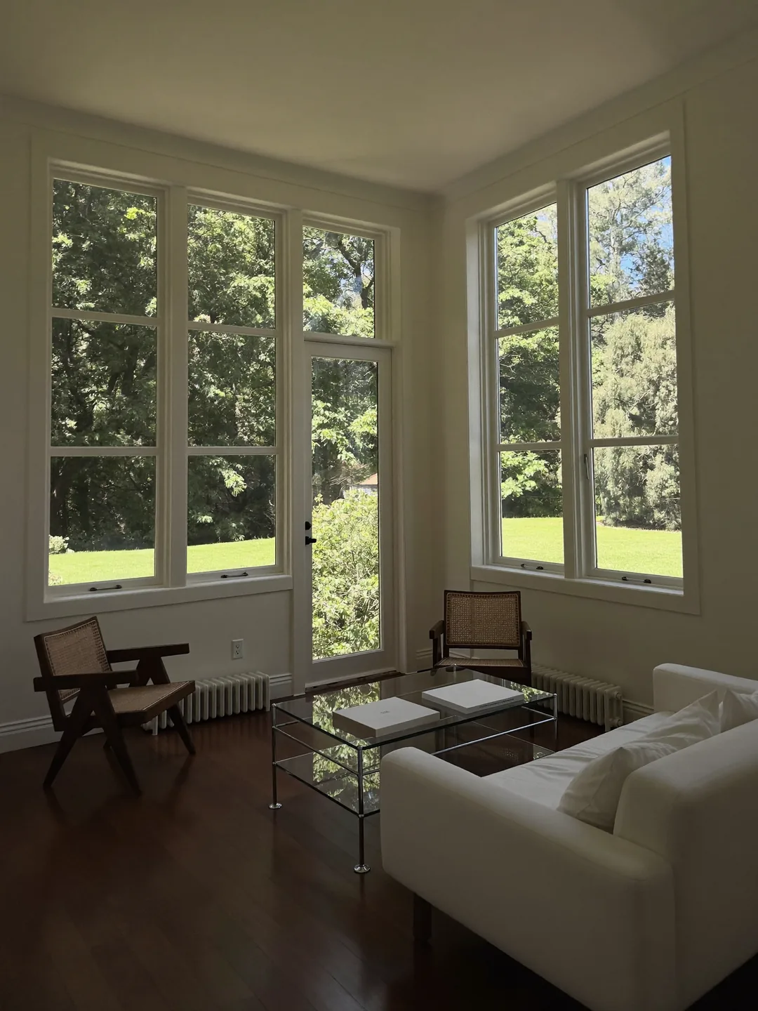 Living room with spotless corner windows after cleaning