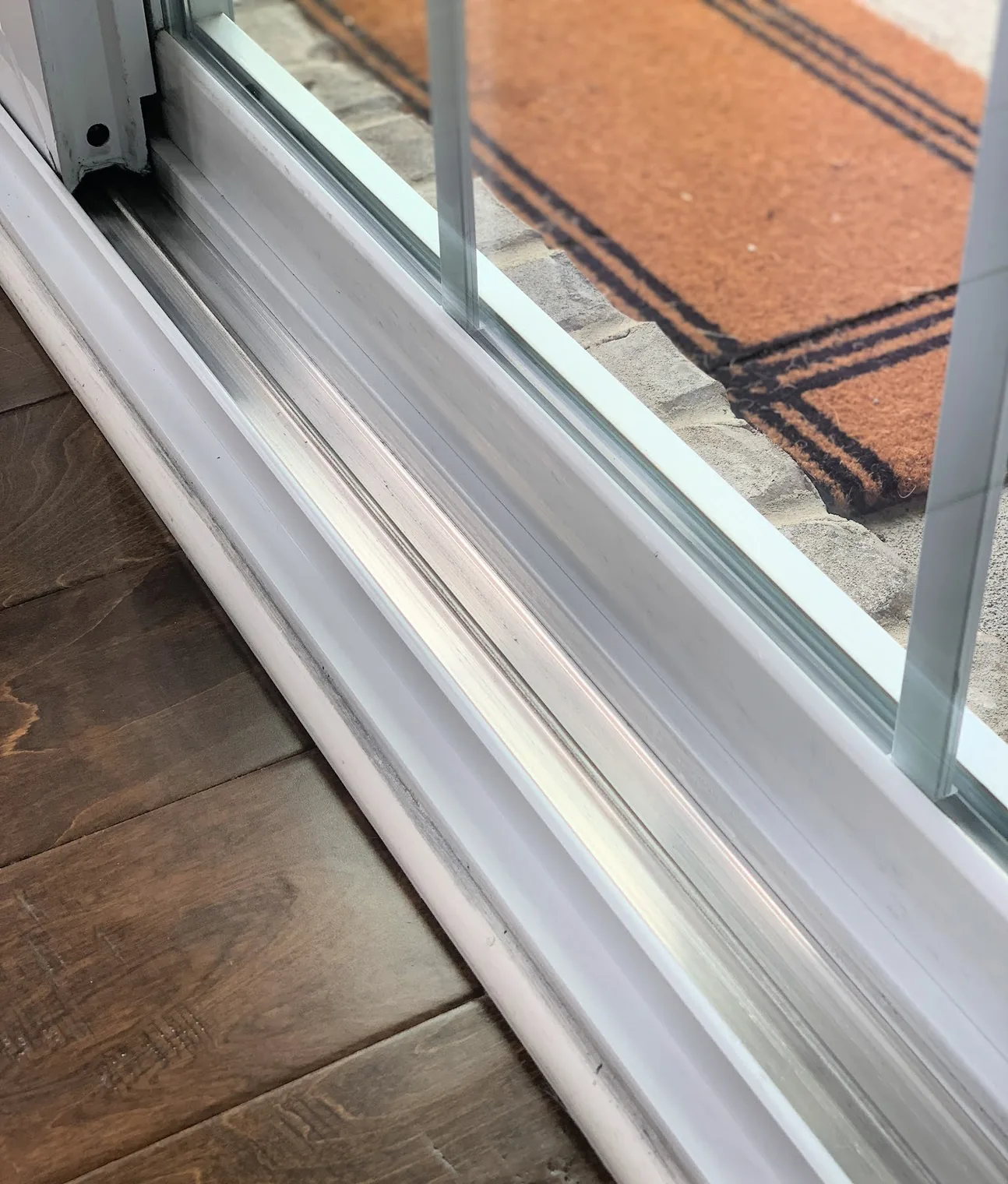 Sliding door track and sill cleaning by Wizards Window Washing